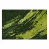 Large wool area rug with dramatic green paint splatter and brushstroke pattern