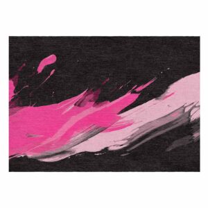 Abstract pink brushstroke pattern on black custom tufted wool rug, featuring dynamic grunge design