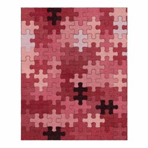 Custom tufted 8x10 rug with interlocking jigsaw puzzle pattern in shades of pink