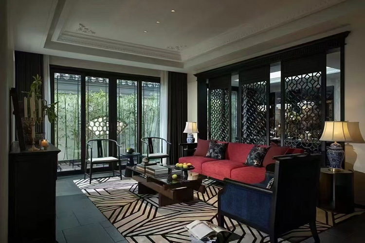 A distant view of a bold geometric tufted wool rug in a traditional Chinese style living room