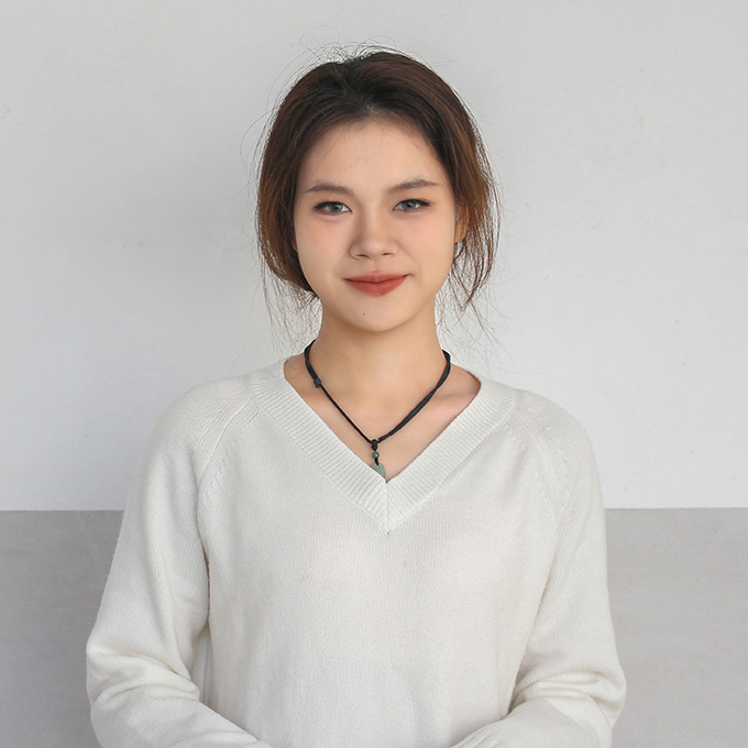 The business representative lady of tufted rug customization company in front of a white wall, wearing a white shirt