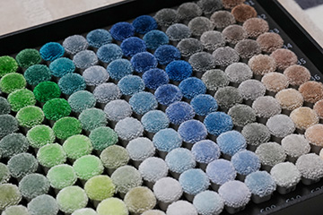 Color palettes of rayon silk for hand tufted rugs and carpets made to order, featuring green, grey and blue colors