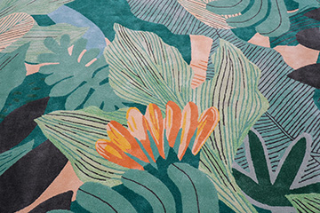 Bespoke hand tufted wool rug with tropical leaves and flowers in vibrant greens