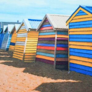 A printed polyester beach huts rug, focusing on the colorful striped facades of several huts (yellow, blue, multi-colored) with their distinctive peaked roofs.